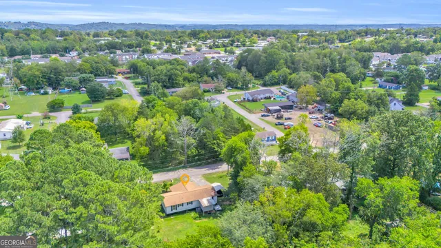 an aerial view of a house with a yard