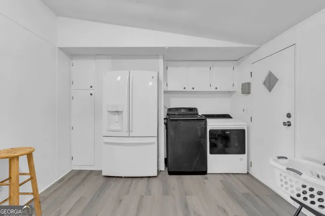 a view of kitchen with wooden floor