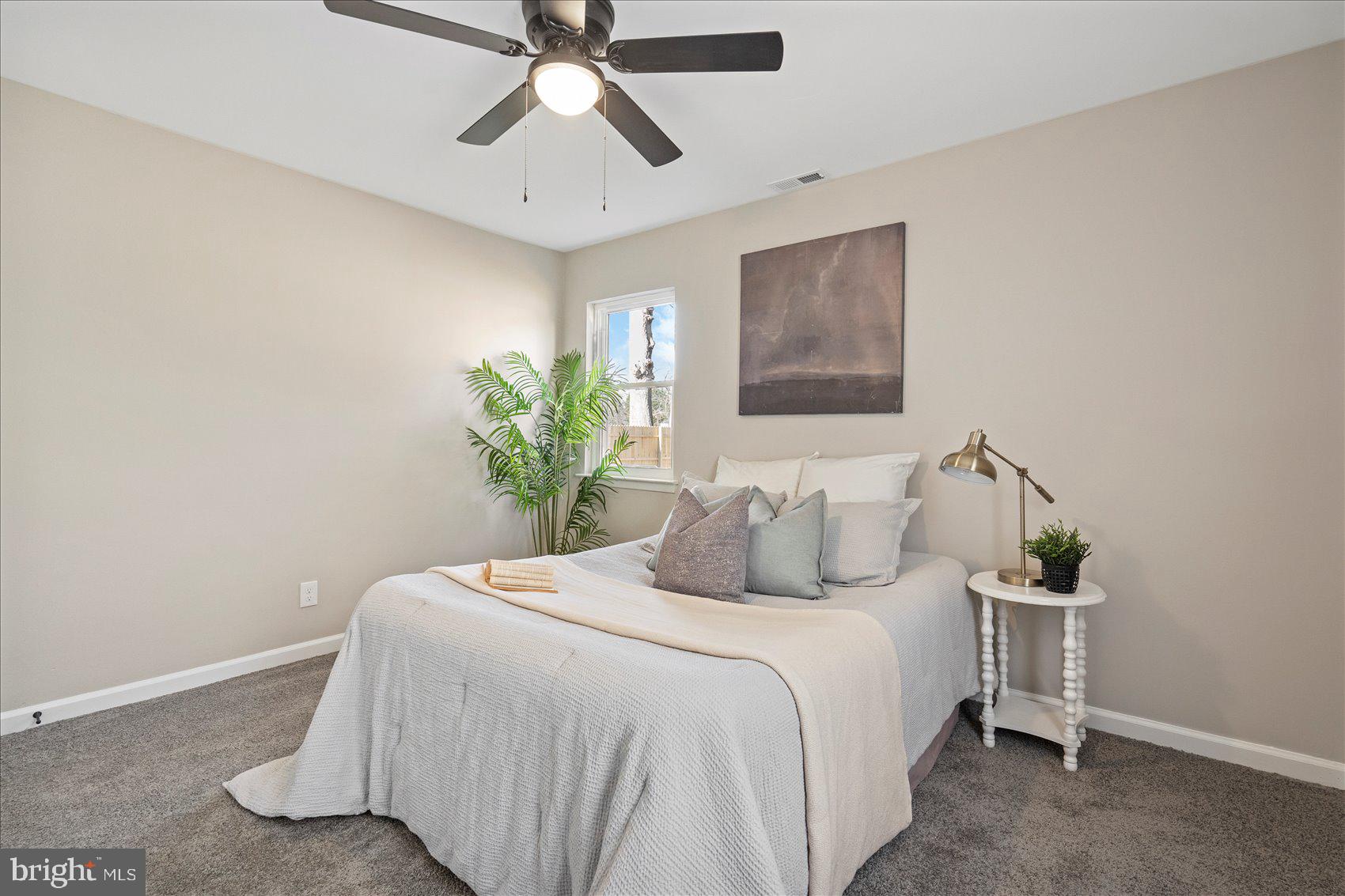 3466 Albantowne Way Edgewood, MD 21040 - Photo 20 of 36 a bedroom with a bed and a potted plant