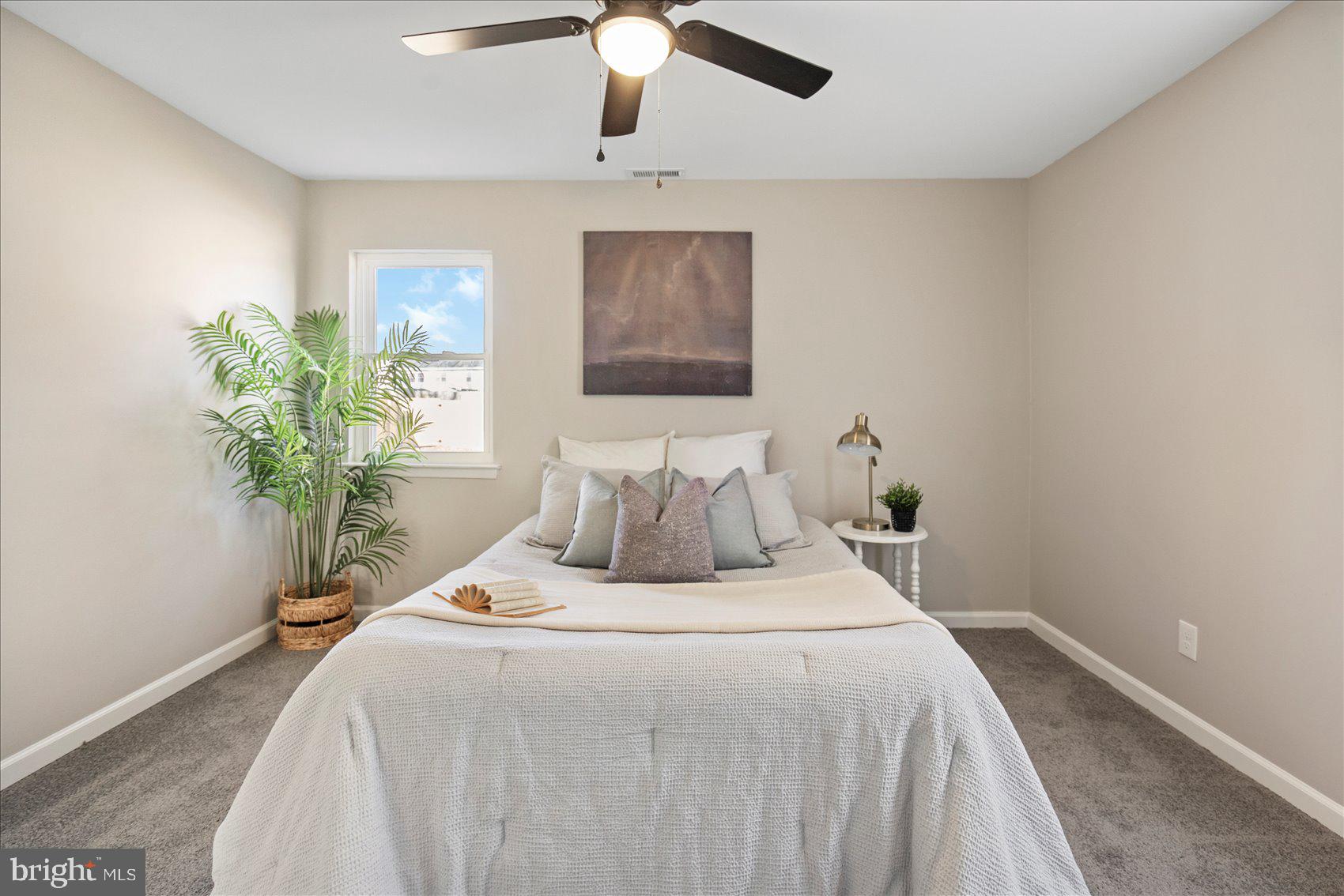 3466 Albantowne Way Edgewood, MD 21040 - Photo 22 of 36 a bedroom with bed and a potted plant