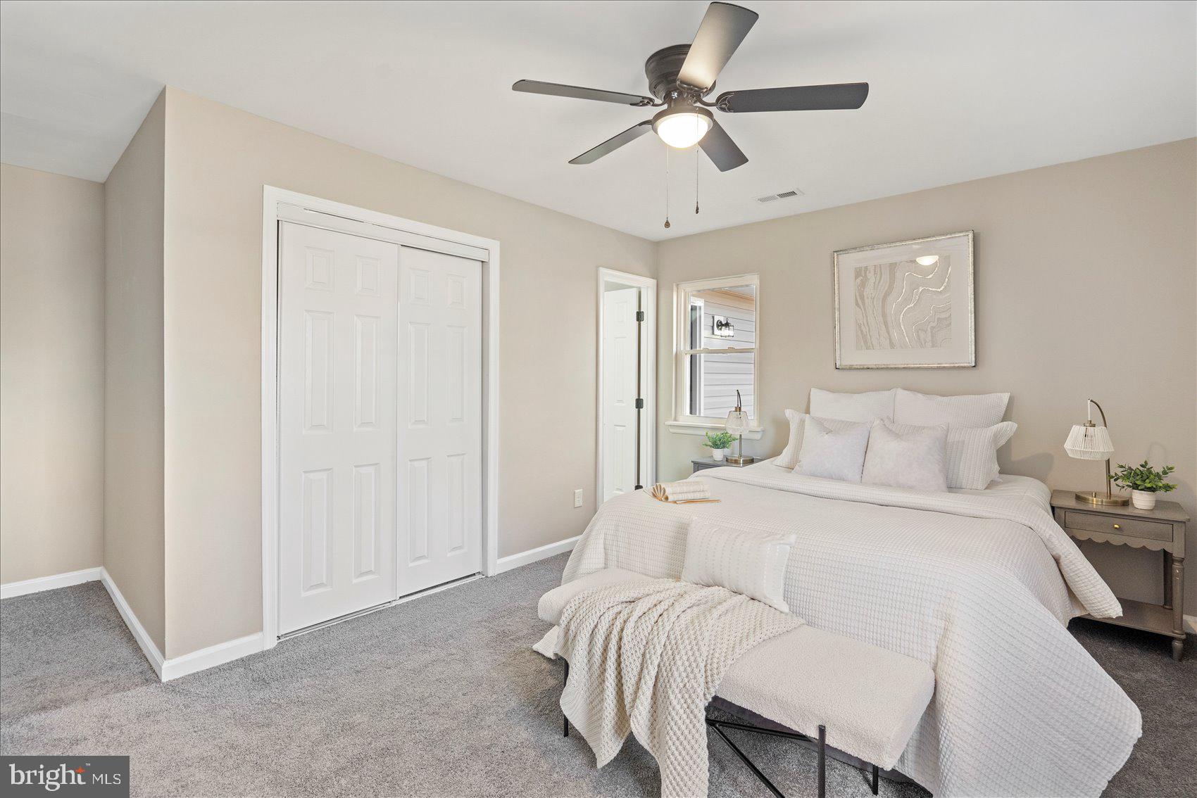 3466 Albantowne Way Edgewood, MD 21040 - Photo 24 of 36 a spacious bedroom with a bed and a chandelier