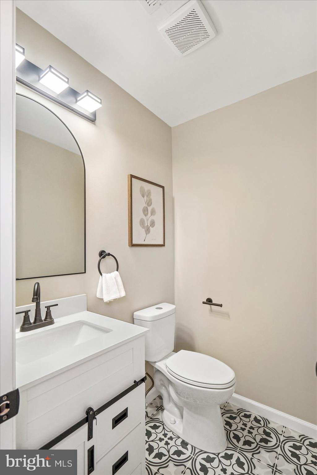 3466 Albantowne Way Edgewood, MD 21040 - Photo 26 of 36 a bathroom with a sink toilet and a mirror