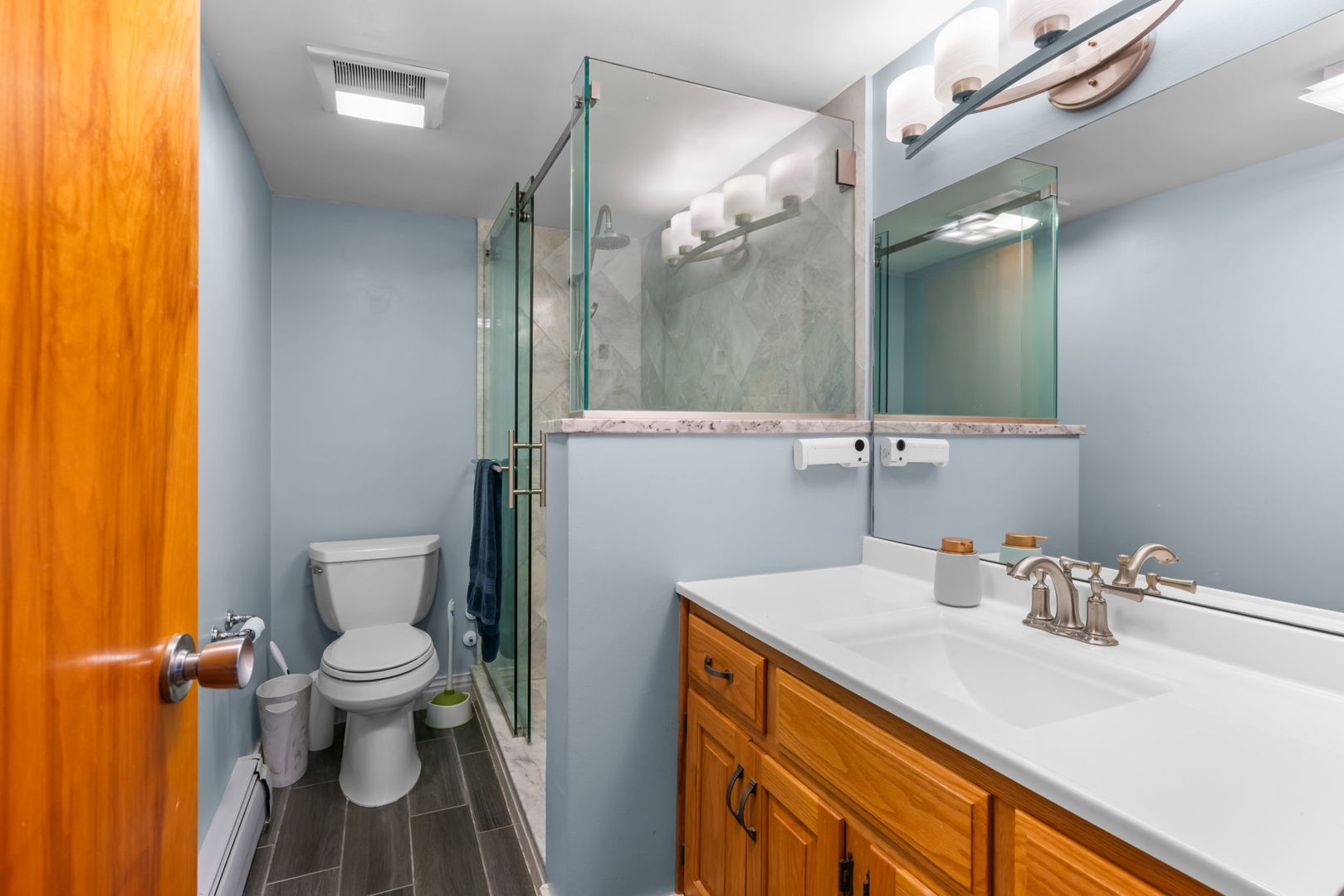 222 North Grove Avenue, Unit 2B Oak Park, IL 60302 - Photo 17 of 20 a bathroom with a sink and a mirror