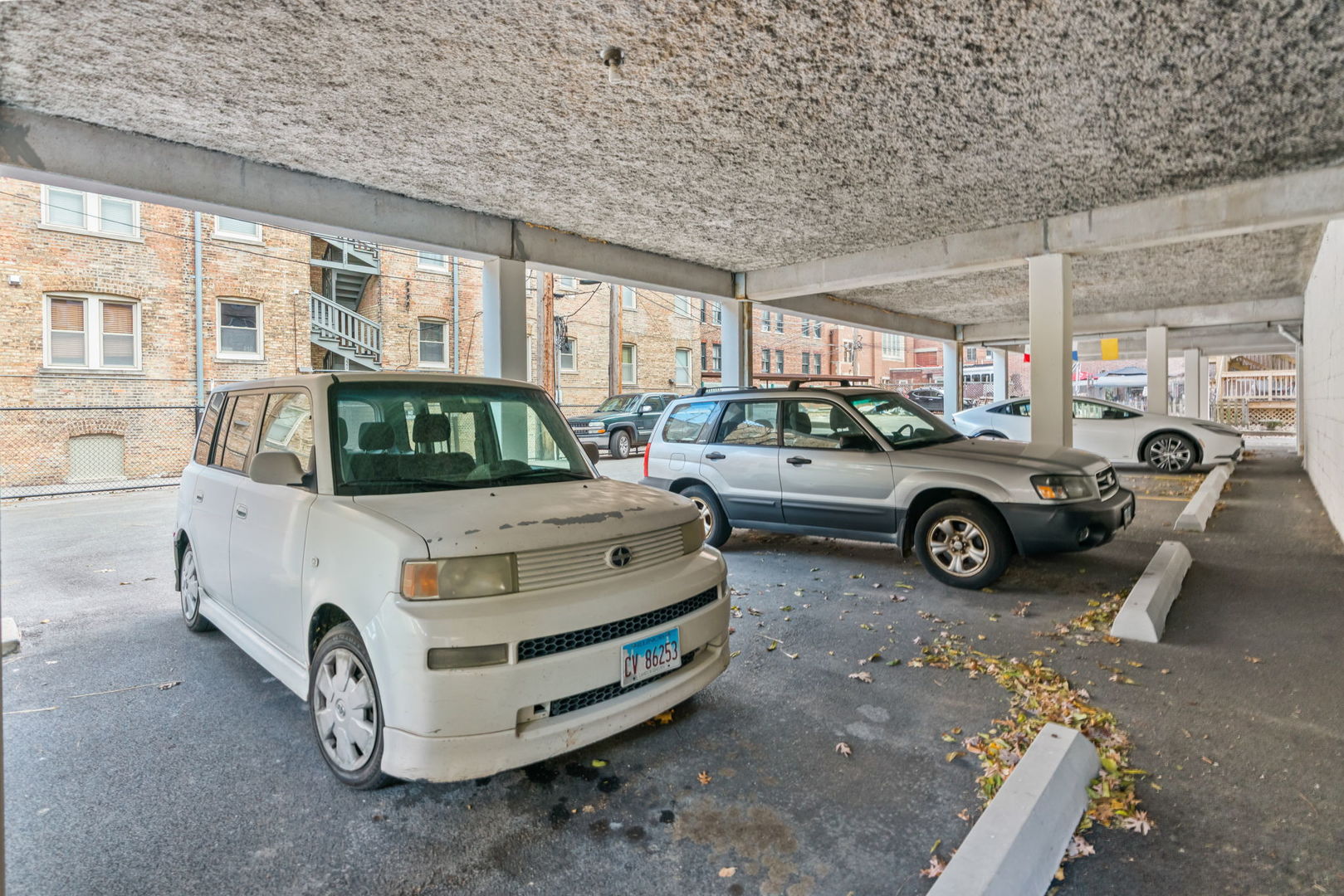 222 North Grove Avenue, Unit 2B Oak Park, IL 60302 - Photo 20 of 20 a car parked in front of a building