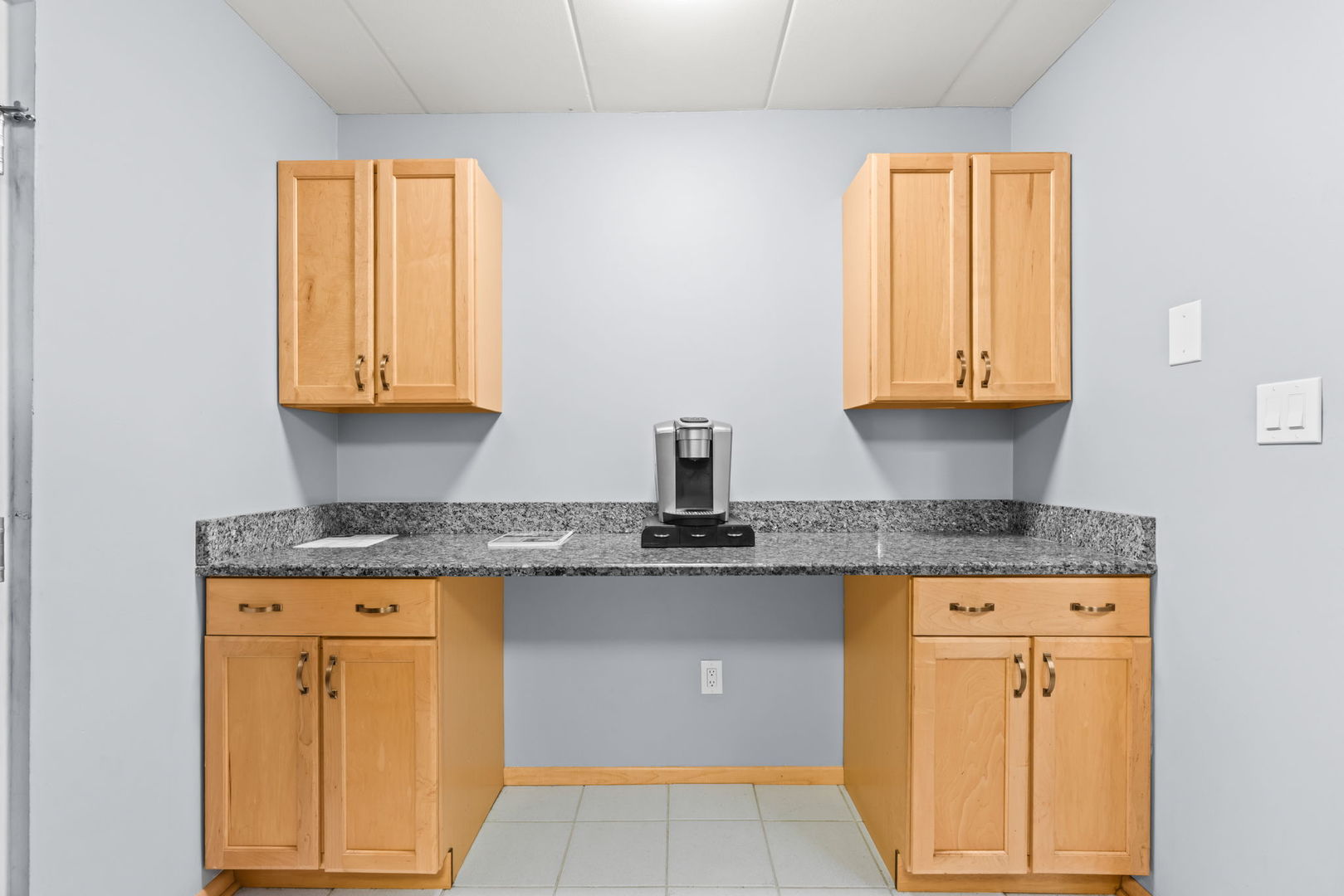 222 North Grove Avenue, Unit 2B Oak Park, IL 60302 - Photo 10 of 20 a kitchen with granite countertop cabinets stainless steel appliances a sink and a window