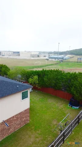 a view of a terrace with yard and lake view
