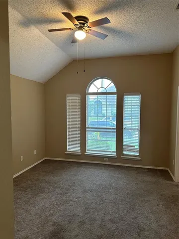a kitchen with a sink cabinets and wooden floor