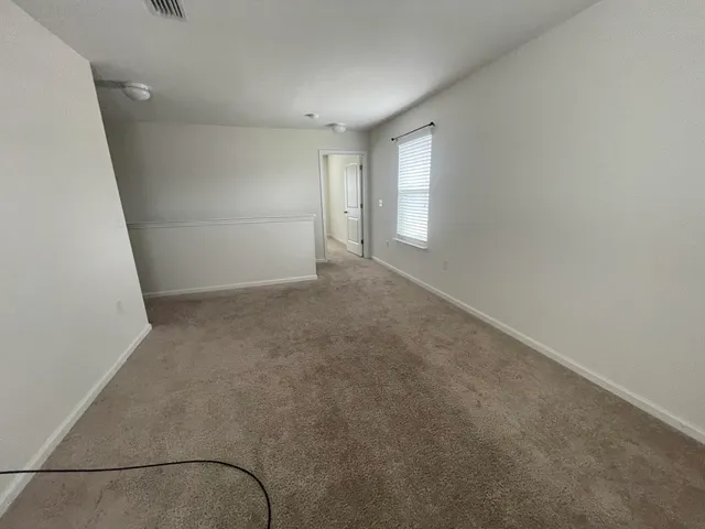 an empty room with windows