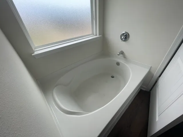 a bathroom with a bathtub