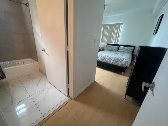 a en suite bathroom with a sink and a mirror