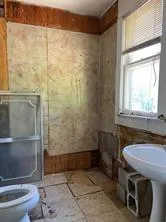 a bathroom with a sink and toilet