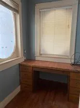 a workspace with furniture and a window