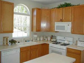 16015 Lavenham Road Huntersville, NC 28078 - Photo 3 of 8 a kitchen with a sink cabinets and window