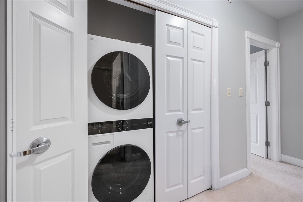 68 Center Street, Unit 13 Barnstable, MA 02601 - Photo 24 of 29 a utility room with dryer and washer