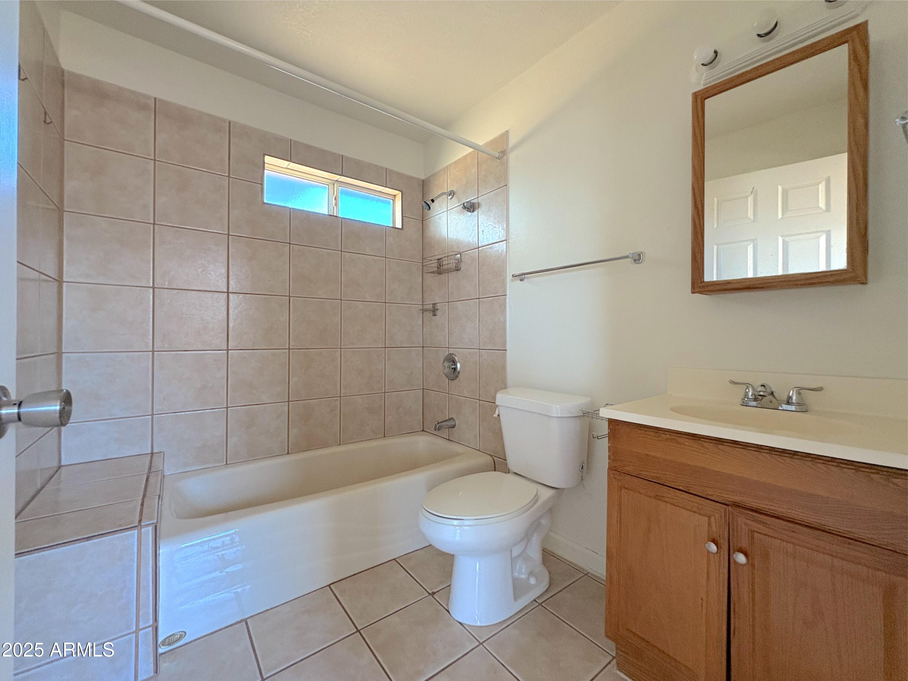 425 North 18th Drive, Unit 3 Phoenix, AZ 85007 - Photo 5 of 10 a bathroom with a sink a toilet and shower