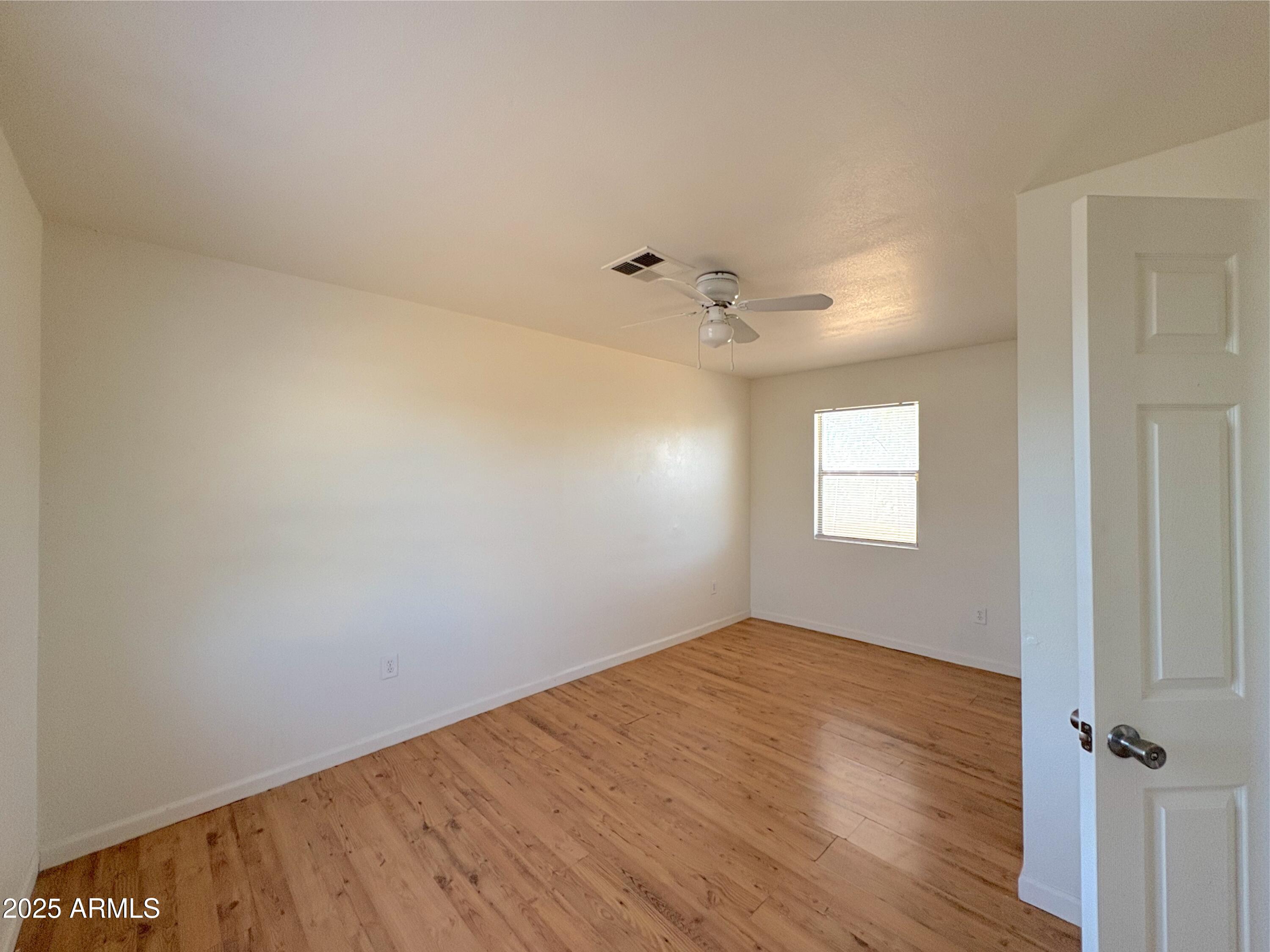 425 North 18th Drive, Unit 3 Phoenix, AZ 85007 - Photo 6 of 10 wooden floor in an empty room