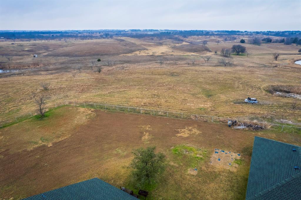 839 Walker Creek Road Ennis, TX 75119 - Photo 35 of 40 a view of an ocean and beach