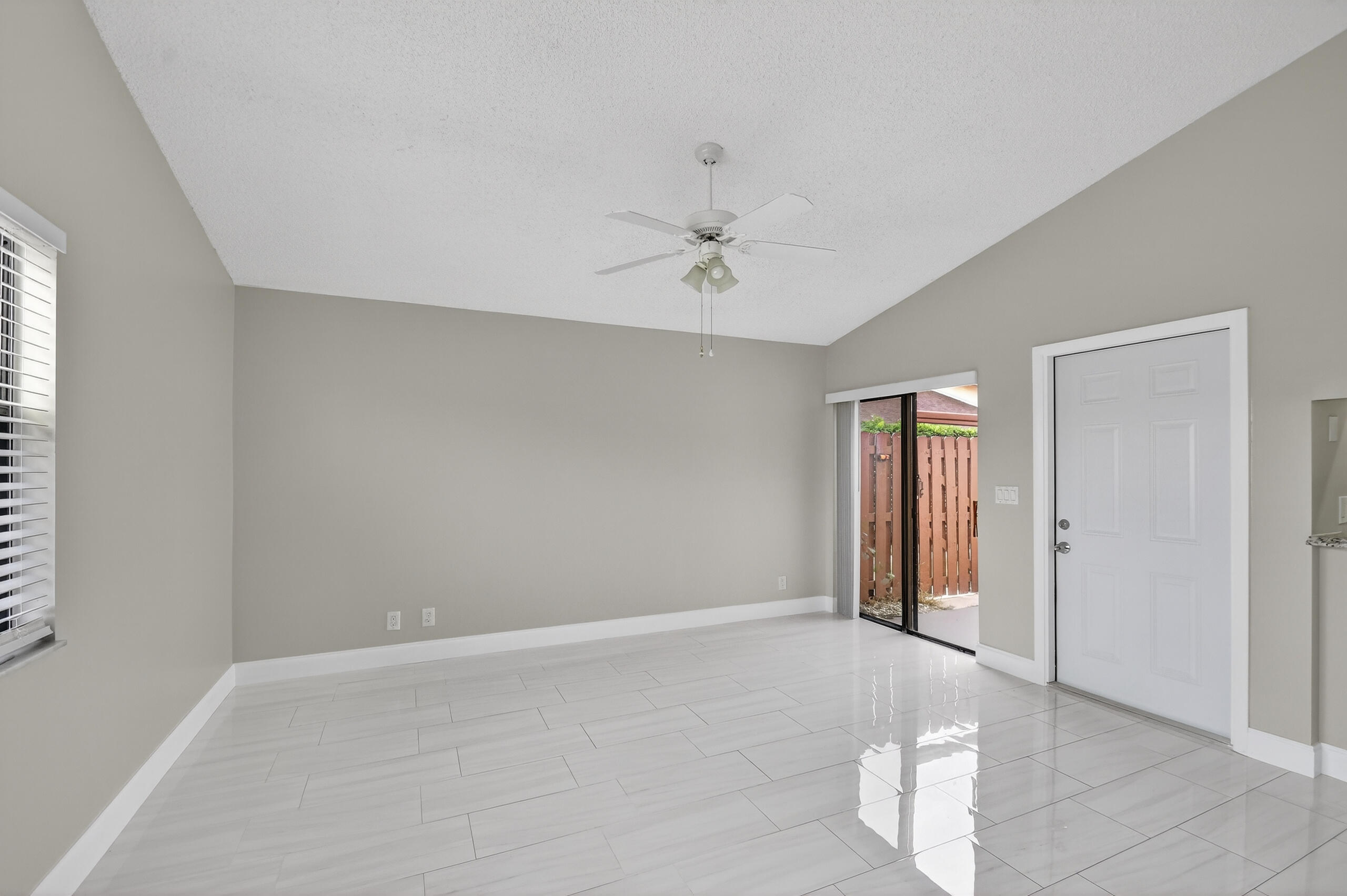 484 Springdale Circle, Unit 48D Palm Springs, FL 33461 - Photo 12 of 59 wooden floor in an empty room with a window