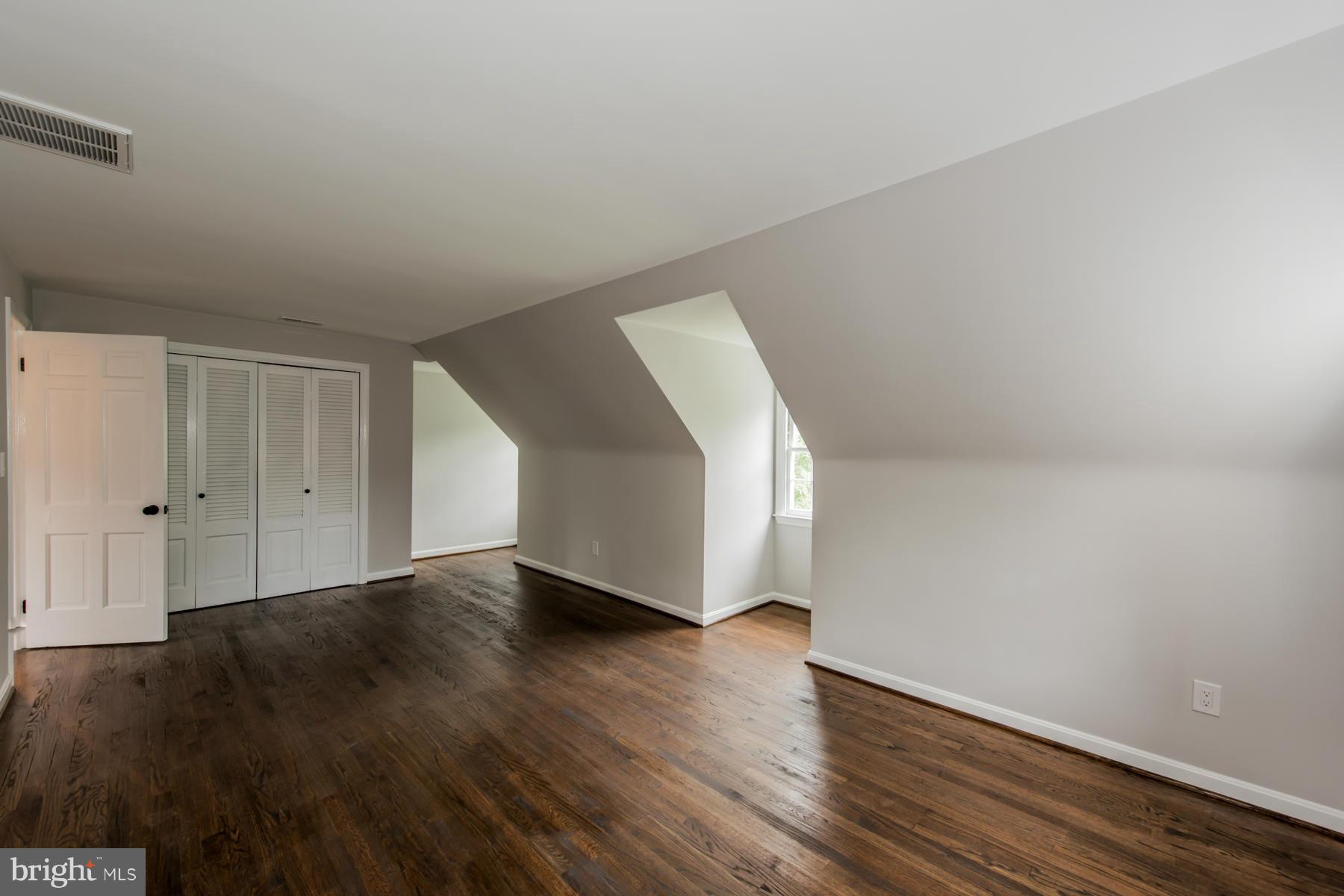 9105 Waycross Road Ellicott City, MD 21042 - Photo 18 of 27 a view of an empty room with wooden floor