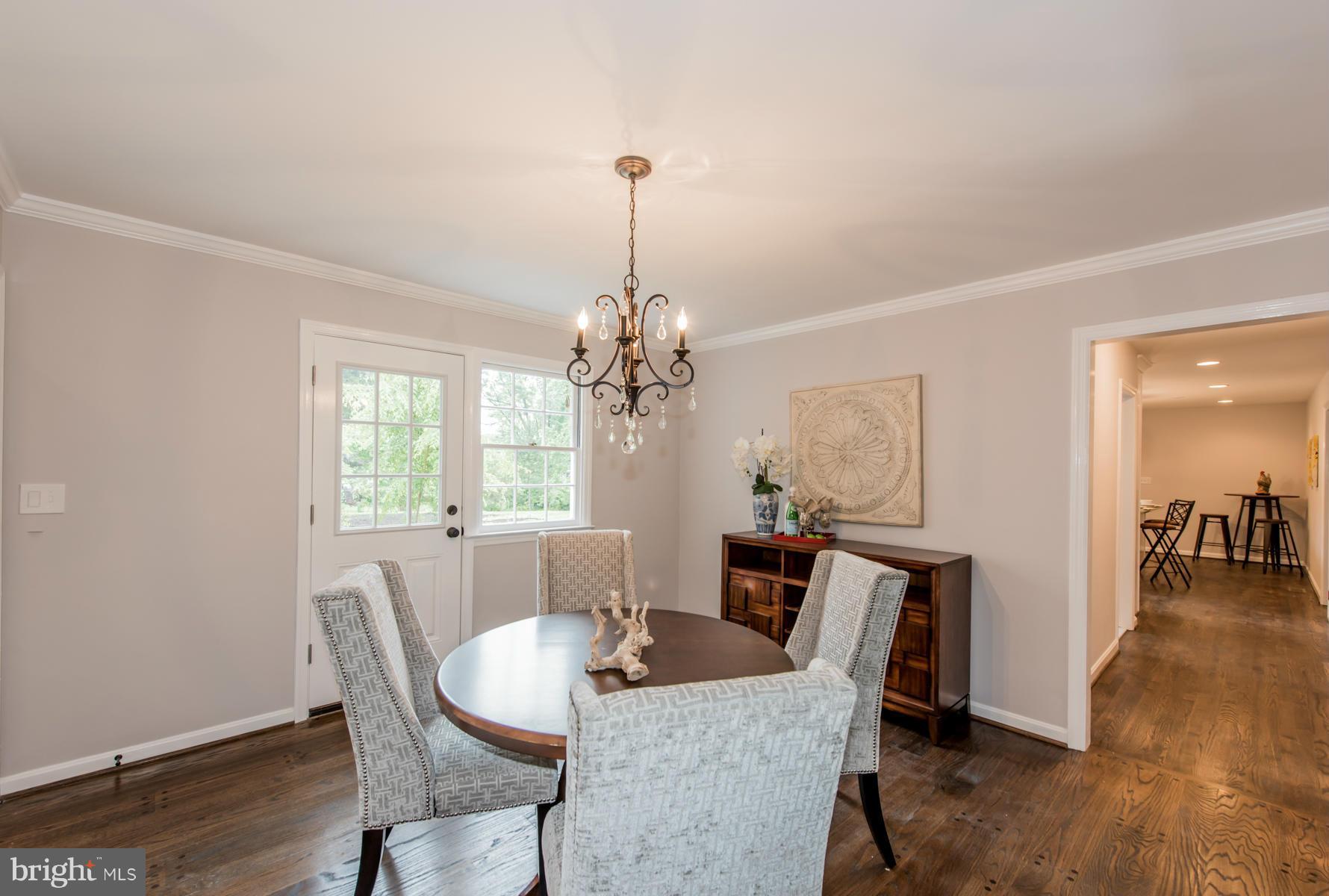 9105 Waycross Road Ellicott City, MD 21042 - Photo 3 of 27 a view of a dining room with furniture window and wooden floor
