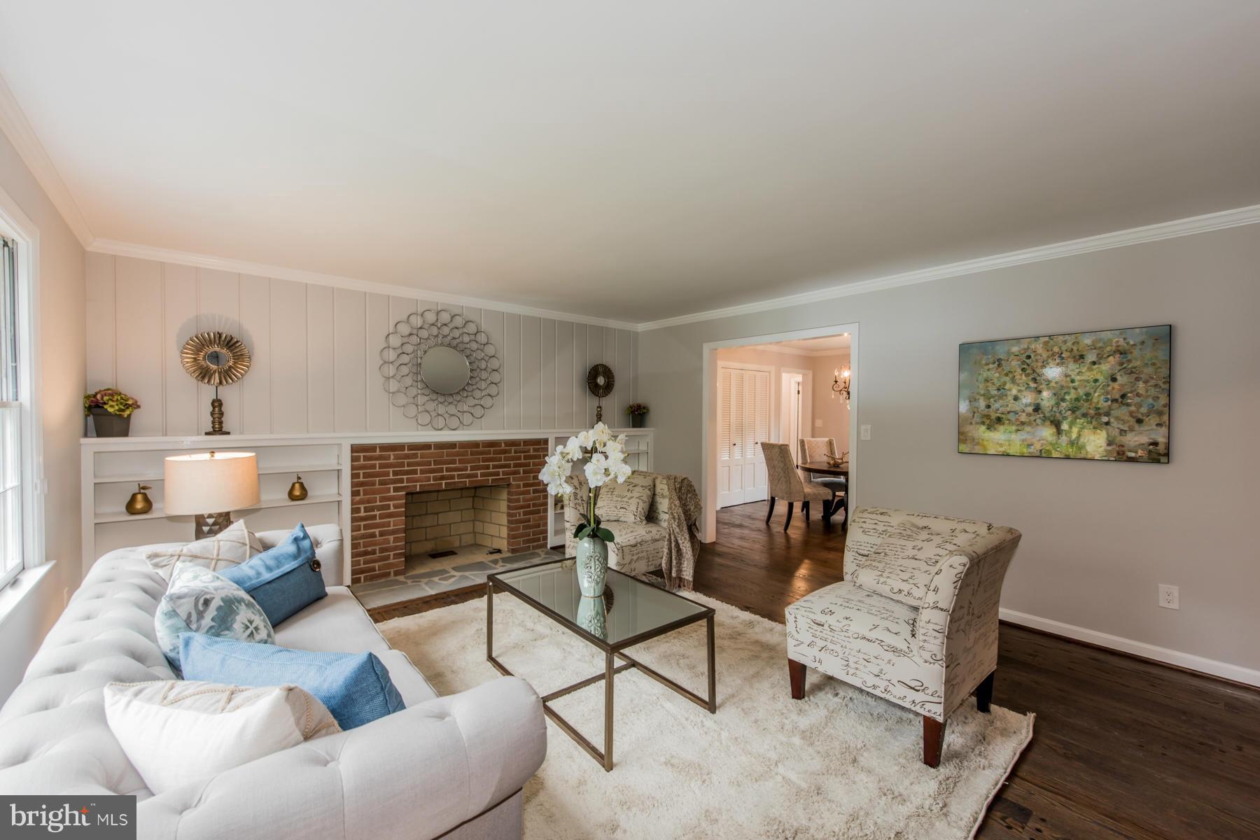 9105 Waycross Road Ellicott City, MD 21042 - Photo 4 of 27 a living room with furniture and a fireplace