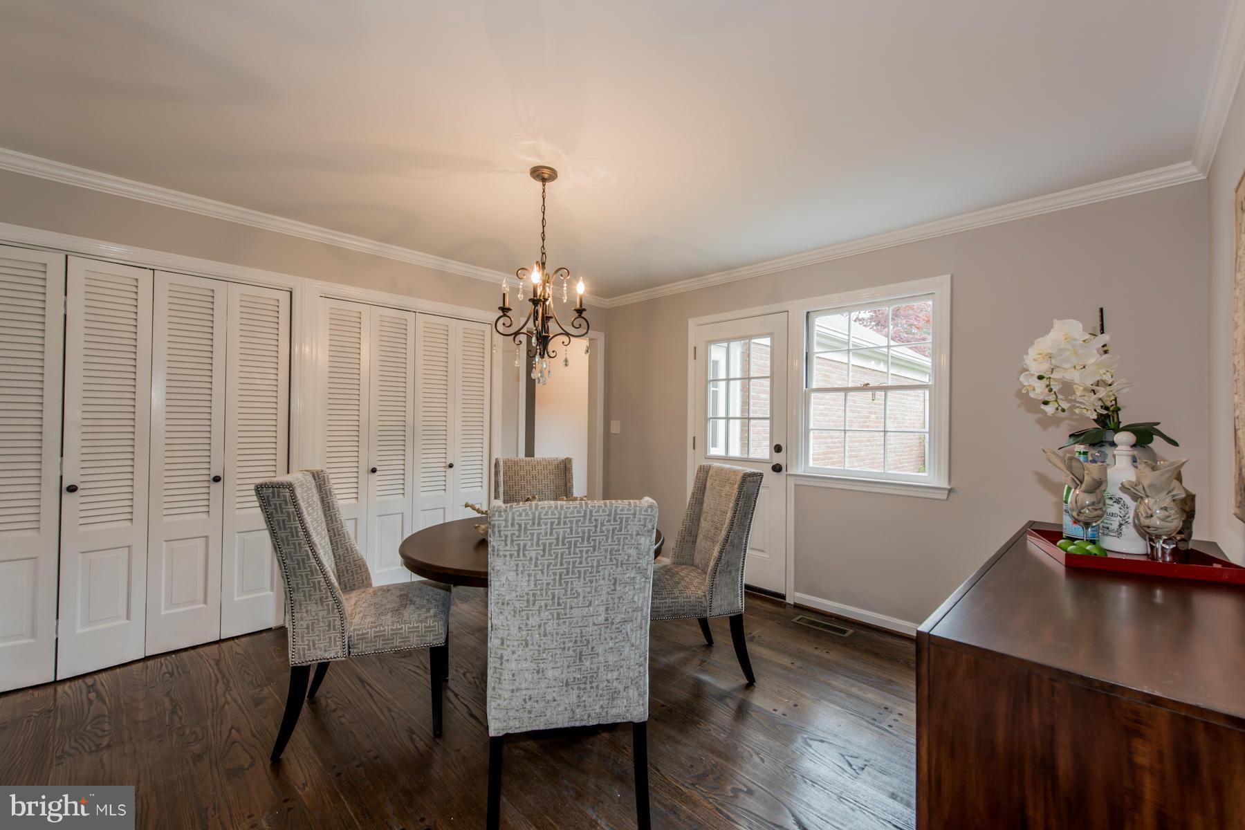 9105 Waycross Road Ellicott City, MD 21042 - Photo 10 of 27 a view of a dining room with furniture window and wooden floor