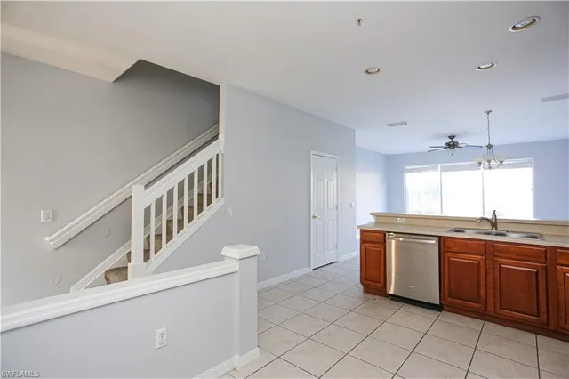 a kitchen with granite countertop a sink and cabinets