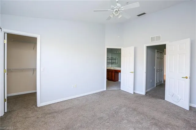 a view of an empty room with a bathroom