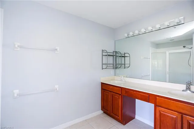 a room with a sink and a mirror