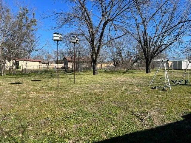 a backyard of a house with lots of green space