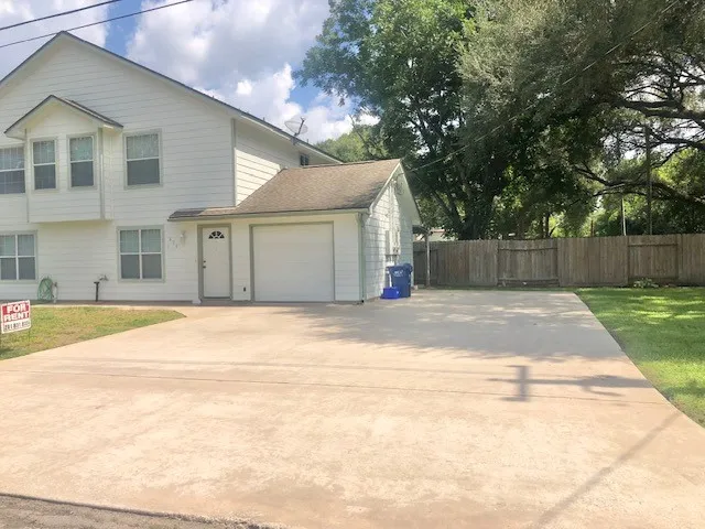 a front view of a house with a outdoor space