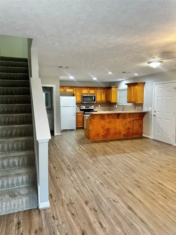 a view of a kitchen with a sink and a stove