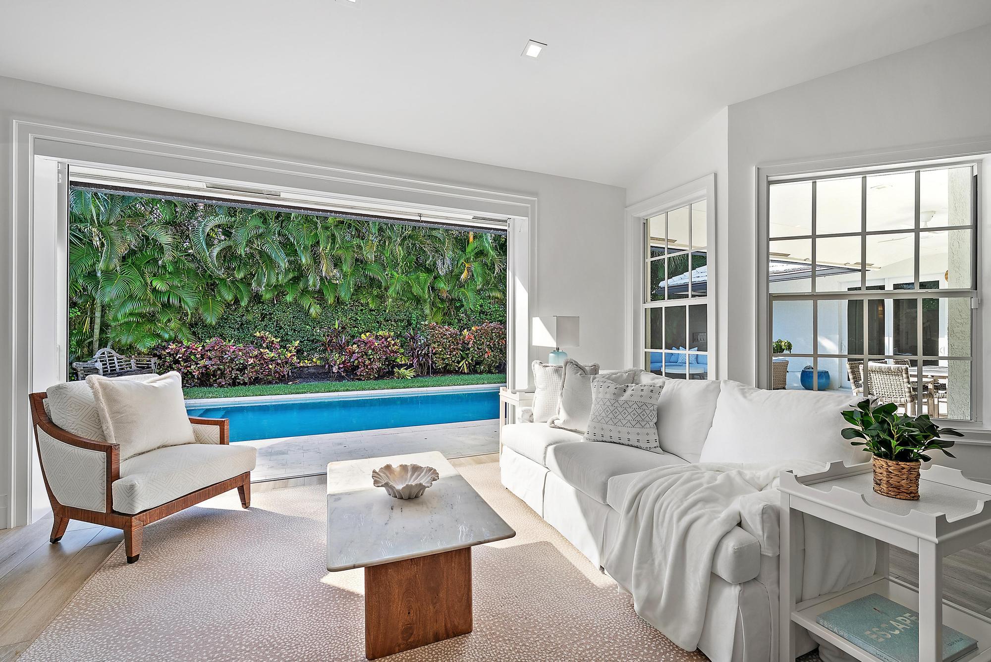 189 Shelter Lane Jupiter Inlet Colony, FL 33469 - Photo 18 of 48 a living room with furniture and a large window