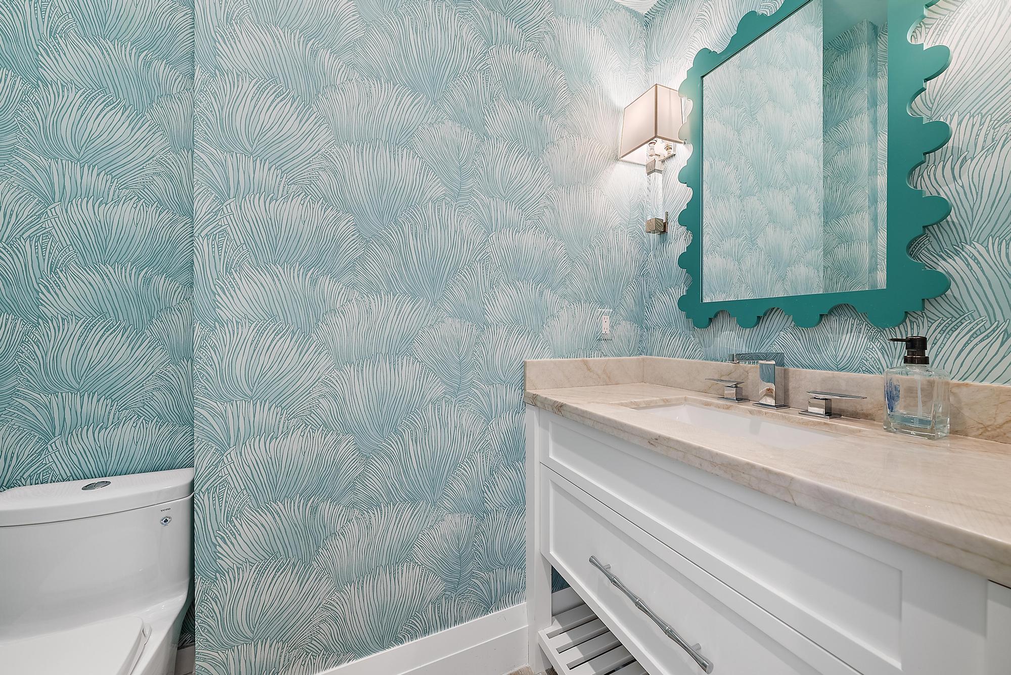 189 Shelter Lane Jupiter Inlet Colony, FL 33469 - Photo 19 of 48 a bathroom with a granite countertop sink a toilet and a shower