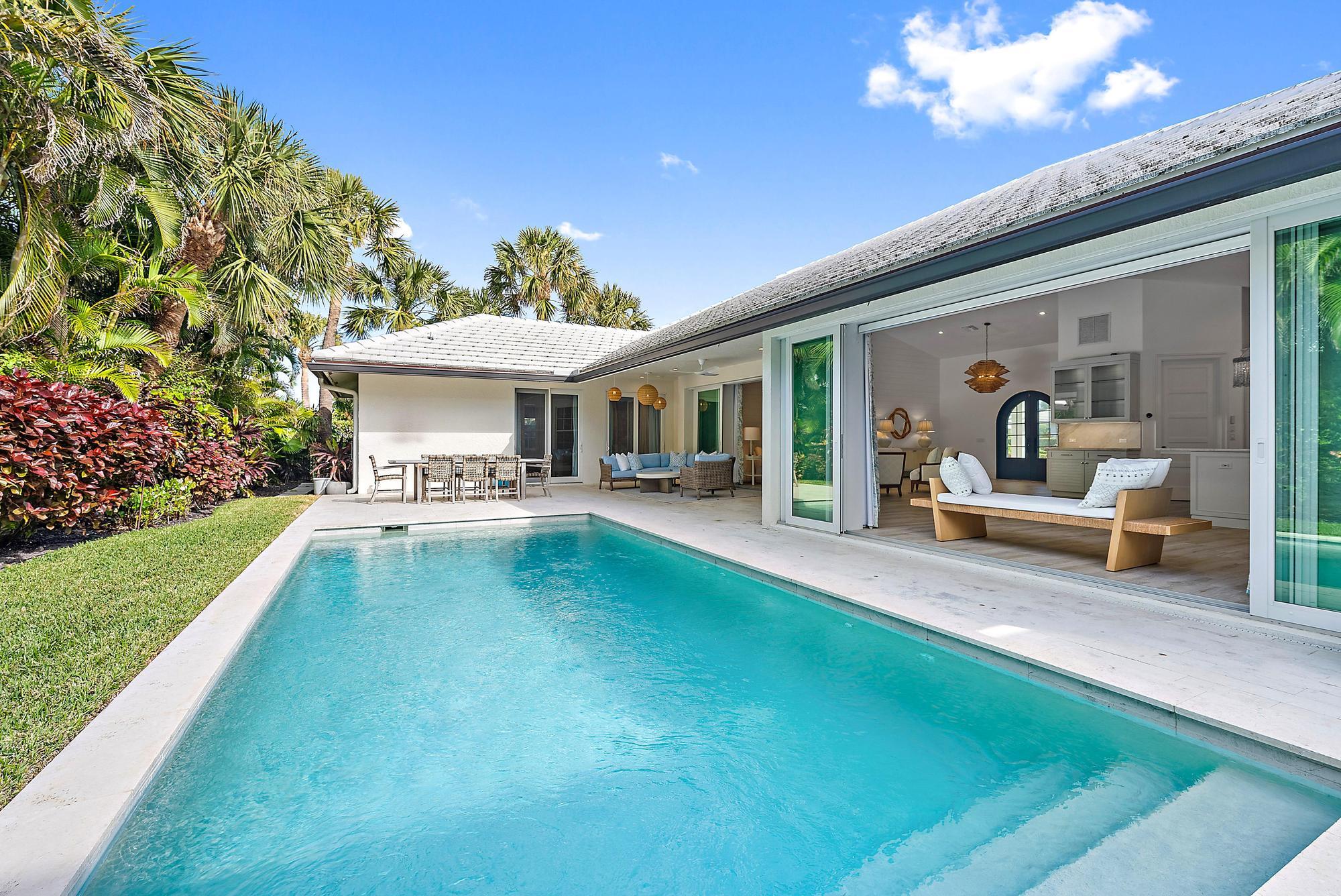 189 Shelter Lane Jupiter Inlet Colony, FL 33469 - Photo 38 of 48 a view of a house with swimming pool and sitting area