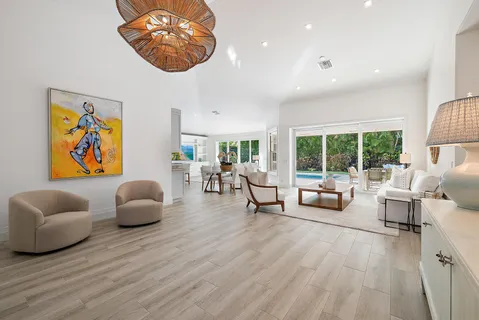 a spacious bedroom with a bed and a large window