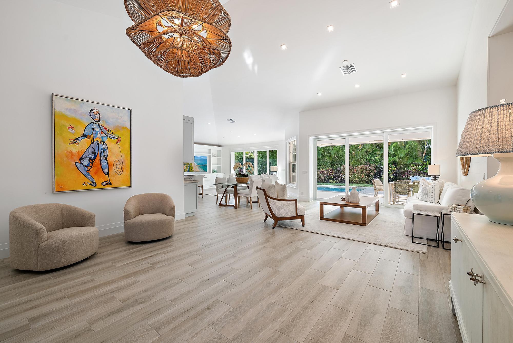 189 Shelter Lane Jupiter Inlet Colony, FL 33469 - Photo 7 of 48 a living room with furniture and a large window