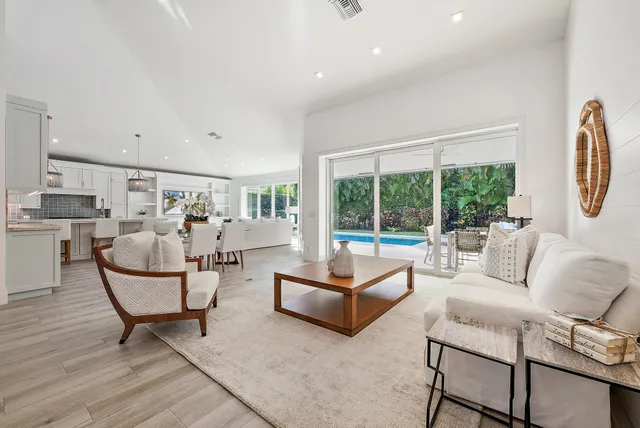 a living room with furniture and a table