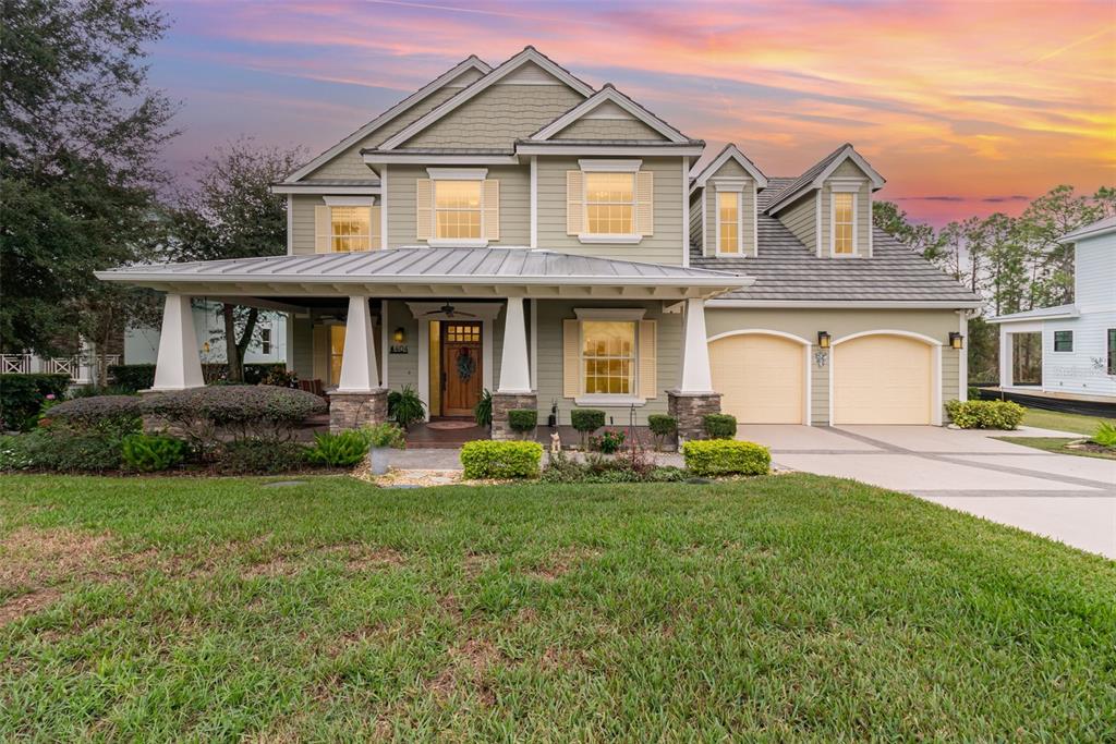 404 Long And Winding Road Howey-in-the-Hills, FL 34737 - Photo 1 of 48 a front view of a house with yard and green space