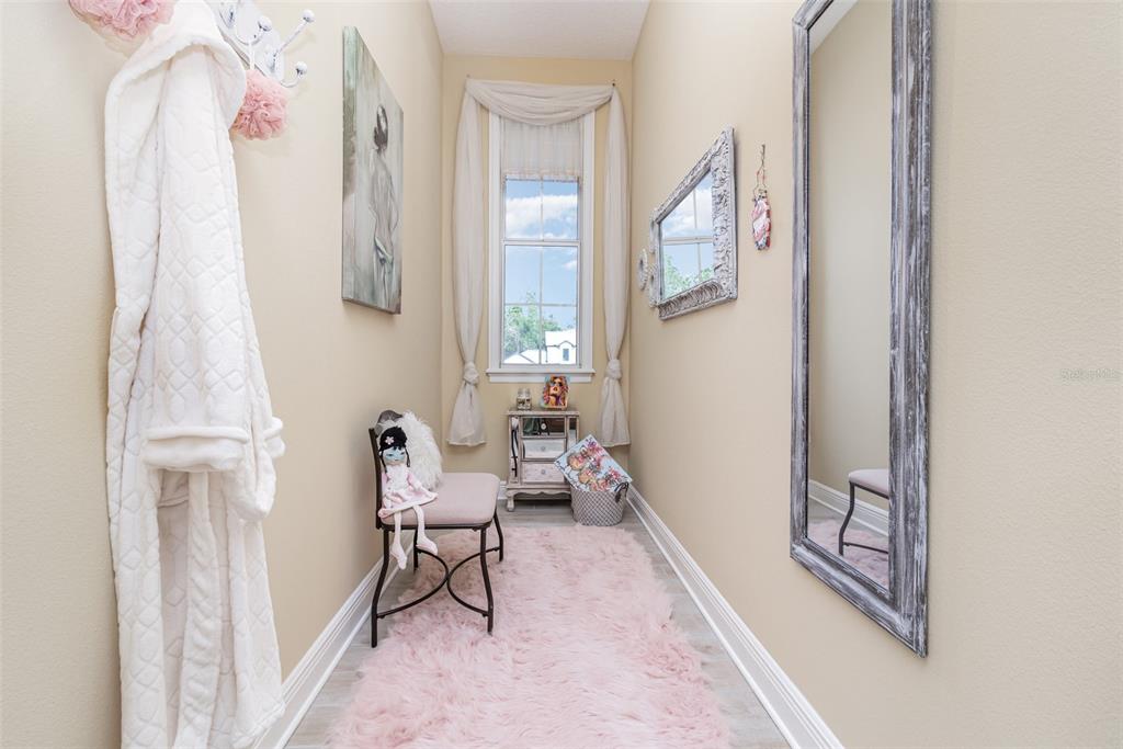 404 Long And Winding Road Howey-in-the-Hills, FL 34737 - Photo 29 of 48 a living room with furniture and a wooden floor