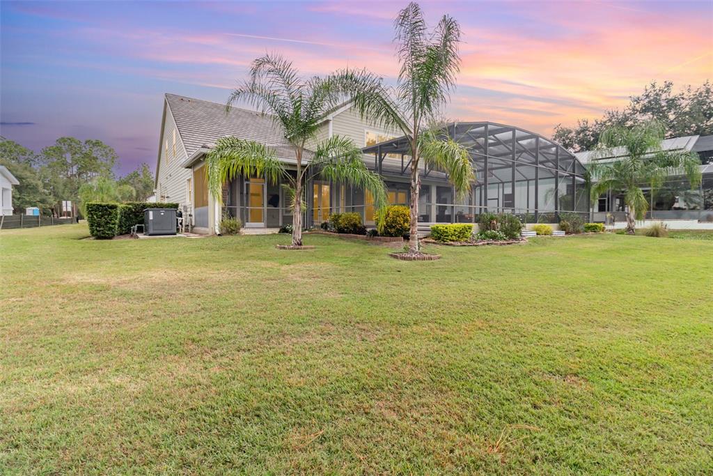 404 Long And Winding Road Howey-in-the-Hills, FL 34737 - Photo 39 of 48 a view of a building with a swimming pool and a big yard
