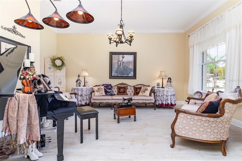 404 Long And Winding Road Howey-in-the-Hills, FL 34737 - Photo 5 of 48 a living room with furniture chess table and a window