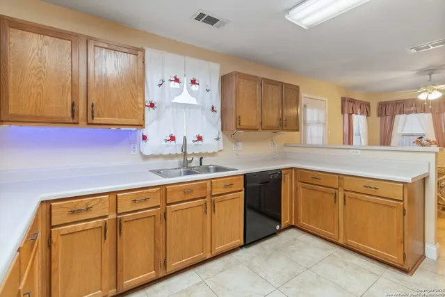 a kitchen with white cabinets
