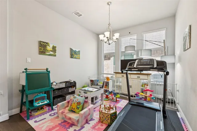 a livingroom with workspace and a window