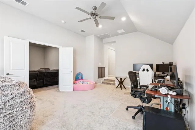 a view of a workspace with furniture and a bedroom