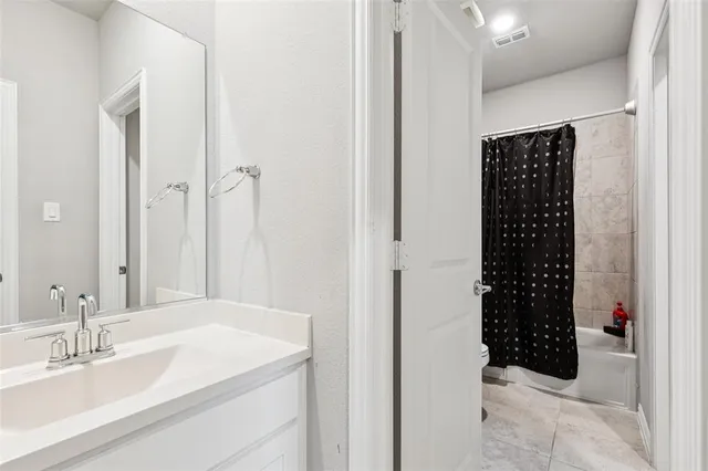 a bedroom with bed and a window