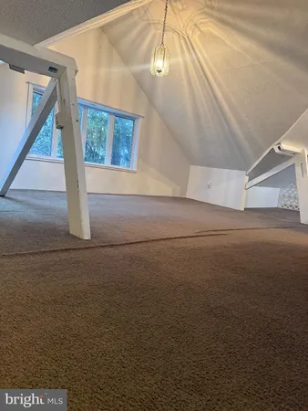 a kitchen with a table and chairs in it