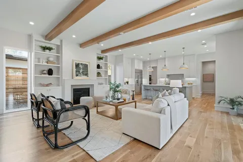 a living room with furniture and fireplace