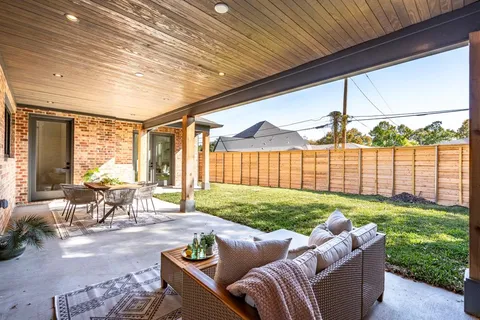 a living room with furniture and a yard