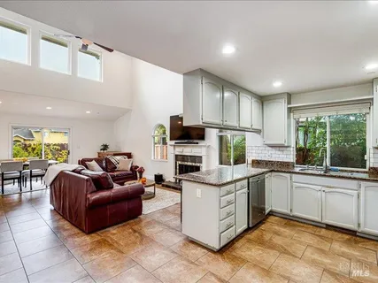 a kitchen with cabinets and window